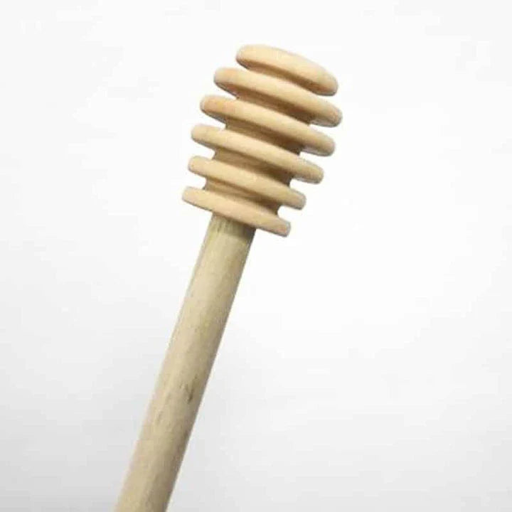 Elegant wooden honey spoon with a smooth, natural finish, perfect for drizzling, stirring, and serving in a Kiwi kitchen