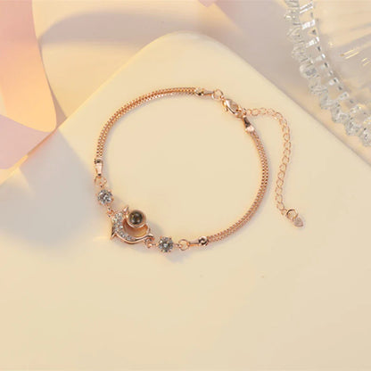 A pair of vibrant projection couple bracelets in rose gold and platinum colors