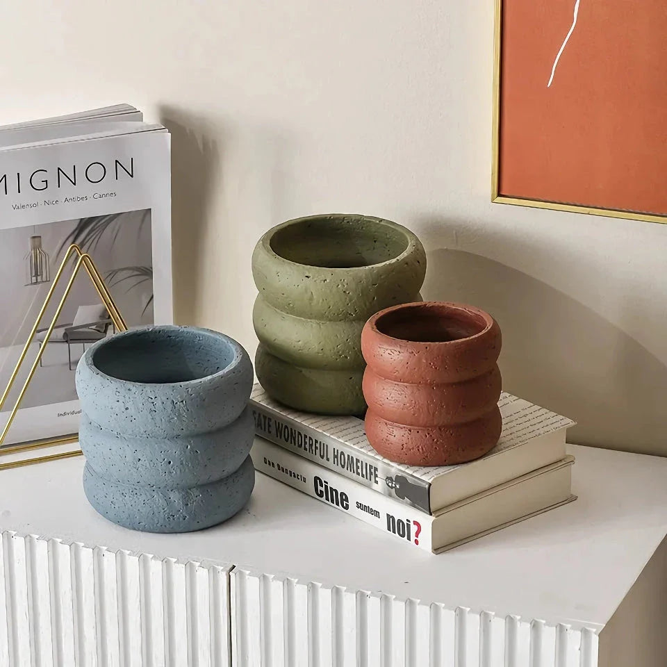 Stylish modern minimalist cement flower pots in two sizes, perfect for showcasing plants and greenery in a Kiwi home