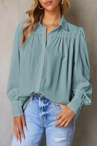 Gathered Detail Puff Sleeve Shirt in blue, featuring a collared neckline, buttoned front, and distinct puff sleeves for a timeless Kiwi style.