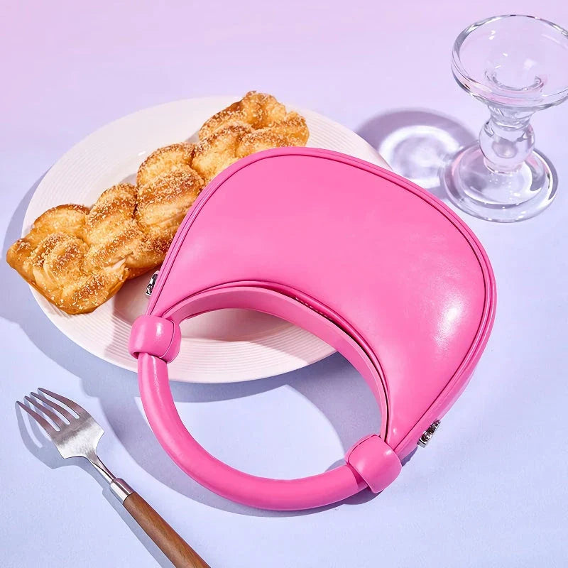 Rose Pink Leather Crescent Crossbody Bag with a unique half-moon design, showcasing premium craftsmanship and versatile functionality