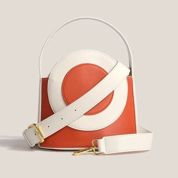 Stylish vegan leather colour block bucket bag with adjustable strap, perfect for modern Kiwi lifestyles