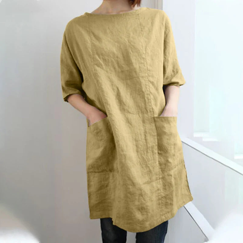 A cotton and linen dress with a round neckline, pockets, and an A-line silhouette in various colors.