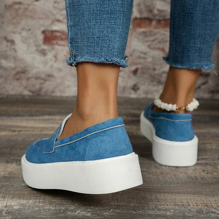 Women's casual platform loafers with a round toe design, slip-on construction, and a durable rubber sole for everyday comfort and style.