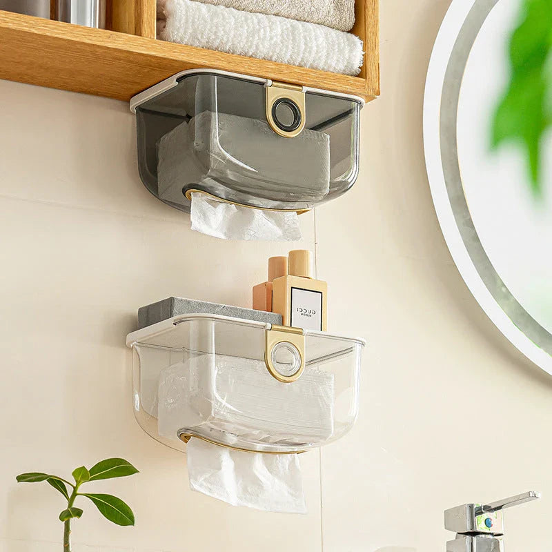 A modern, grey wall-mounted tissue dispenser with a sleek, stylish design to keep tissues and face towels organised in the bathroom or kitchen.