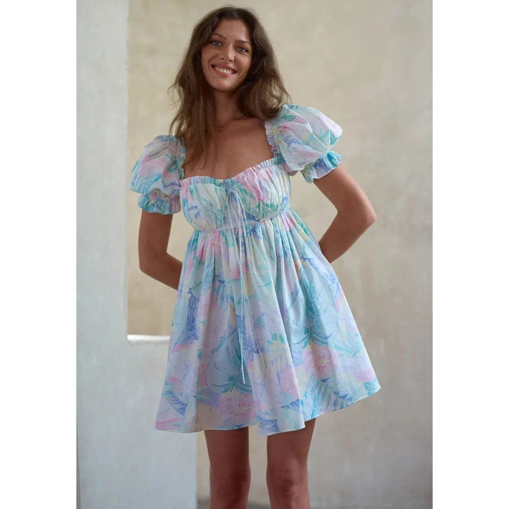 Enchanting fairycore tie-dye mini dress with backless bow-tie detail, perfect for Kiwi fashionistas