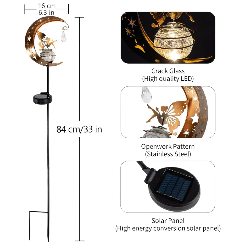 Decorative solar-powered fairy garden light with a glass globe and moon and fairy design for outdoor illumination