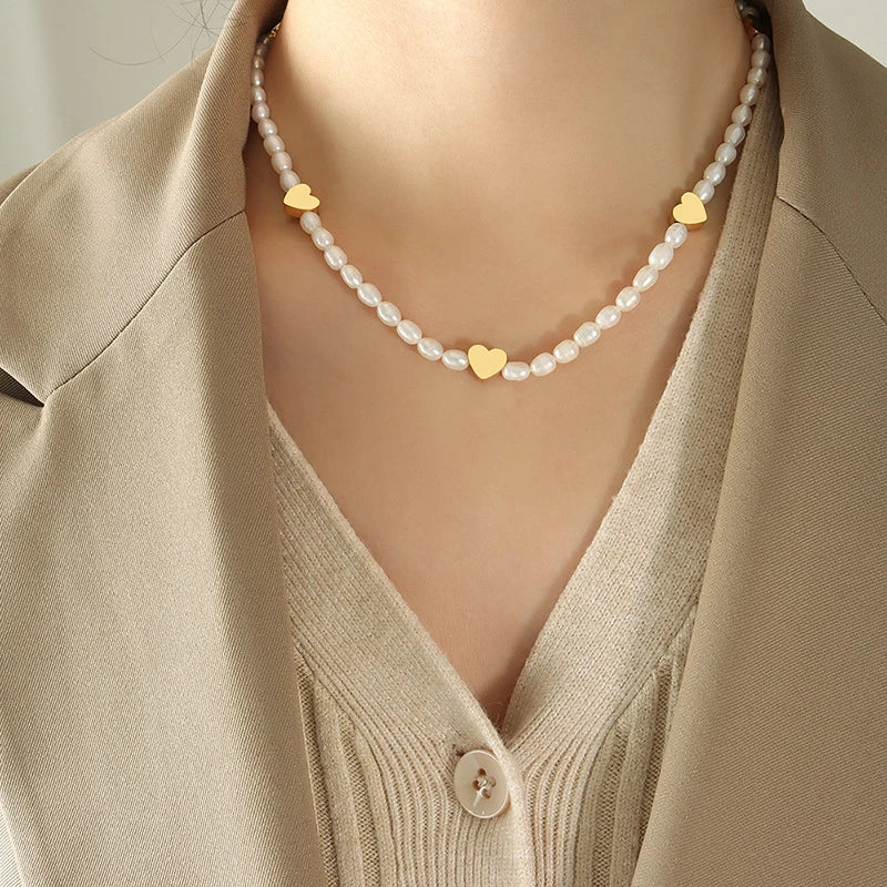 Peach Heart Freshwater Pearl Necklace with a delicate heart design and shimmering pearls, made of durable titanium steel for long-lasting wear