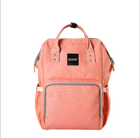 Stylish and practical mummy bag with reinforced handles, durable buckles, and separate bottling area for Kiwi mums