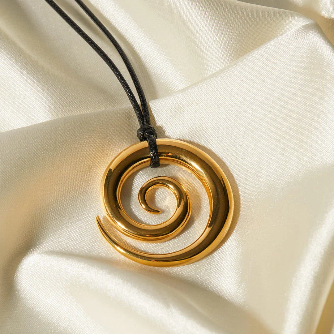 Elegant spiral circle pendant necklace in gold with black rope, a timeless accessory for Kiwi fashionistas