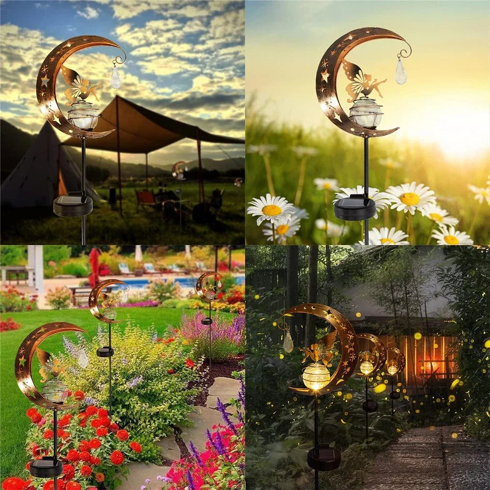 Decorative solar-powered fairy garden light with a glass globe and moon and fairy design for outdoor illumination