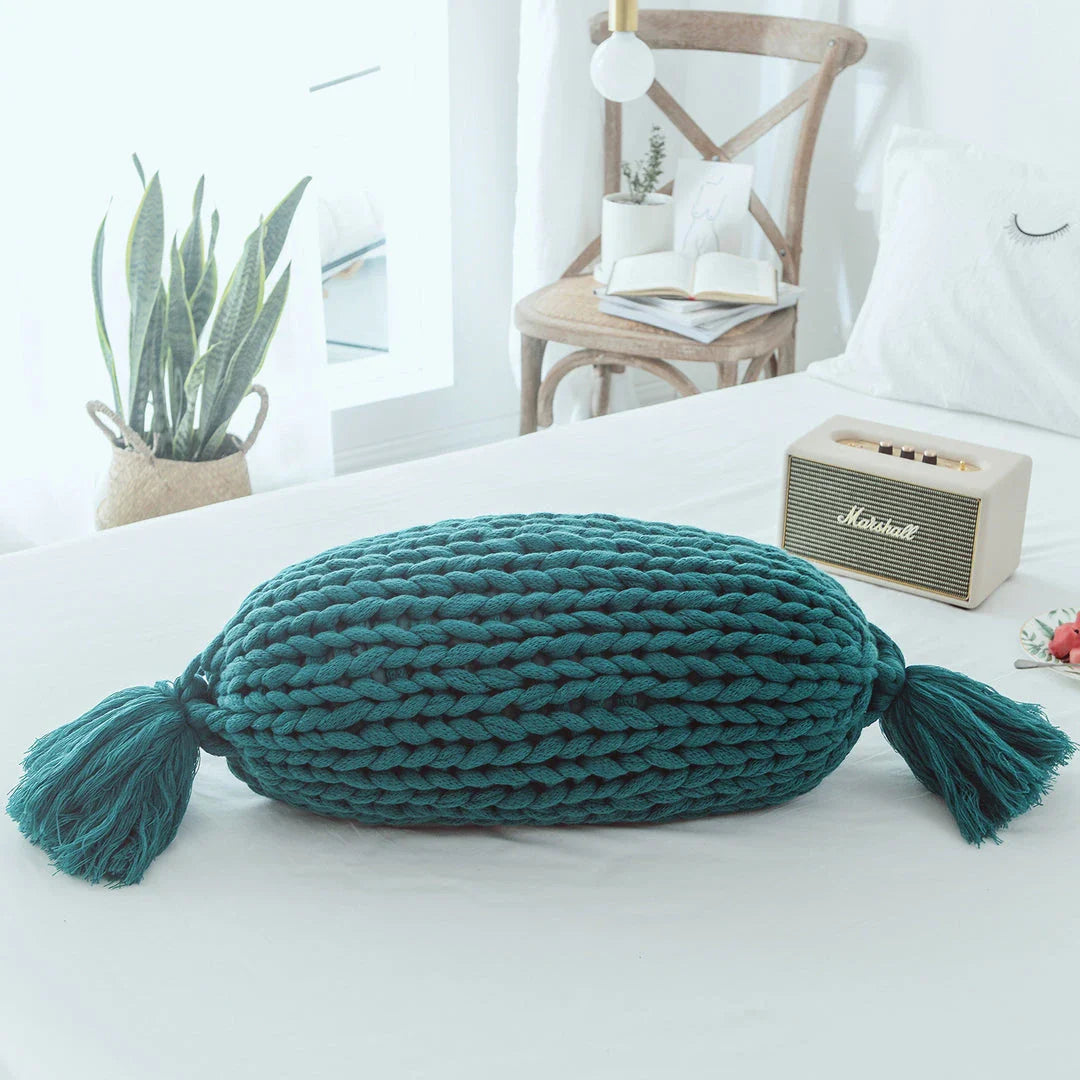 Cosy candy-shaped chunky knit pillow with adorable tassel design, perfect for adding a playful touch to your Kiwi home decor