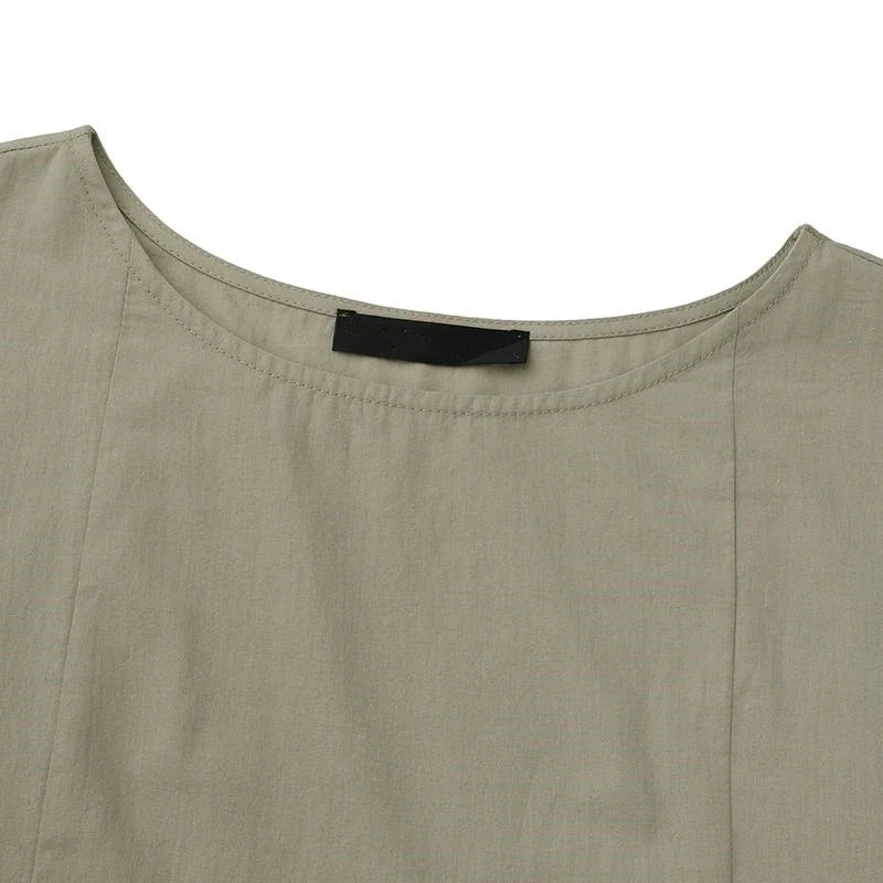 A cotton and linen dress with a round neckline, pockets, and an A-line silhouette in various colors.