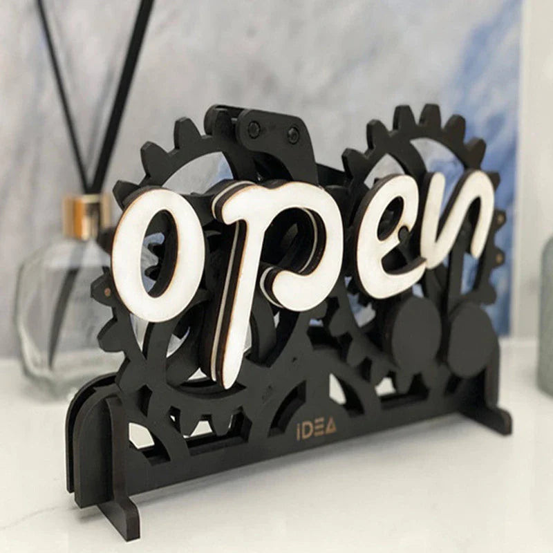 Charming open/closed sign with manual gear mechanism, made of New Zealand pine wood with Kiwiana-inspired design