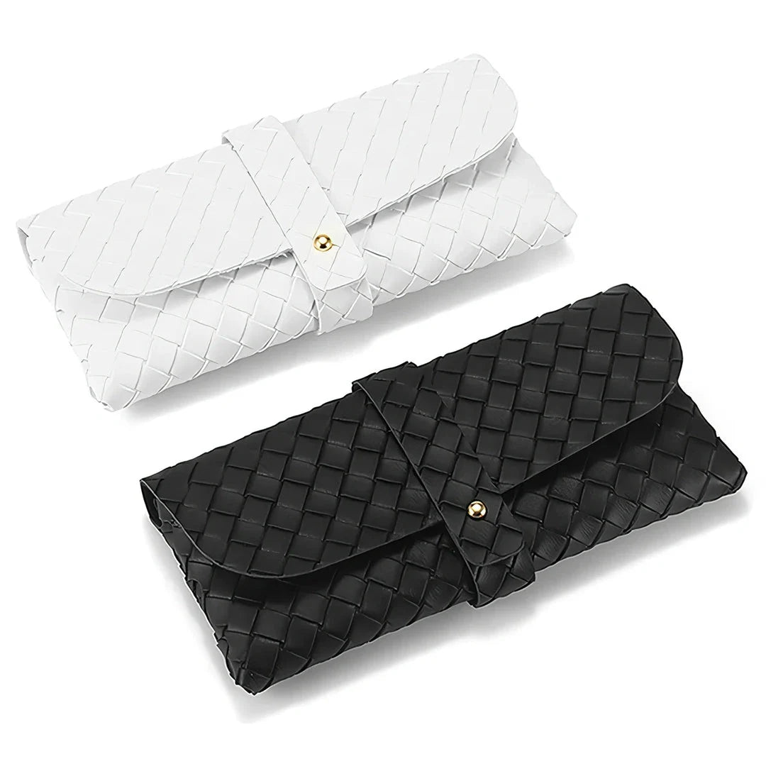 Stylish black and white twist braided leather sunglasses case with snap closure, protecting eyewear in a fashionable way