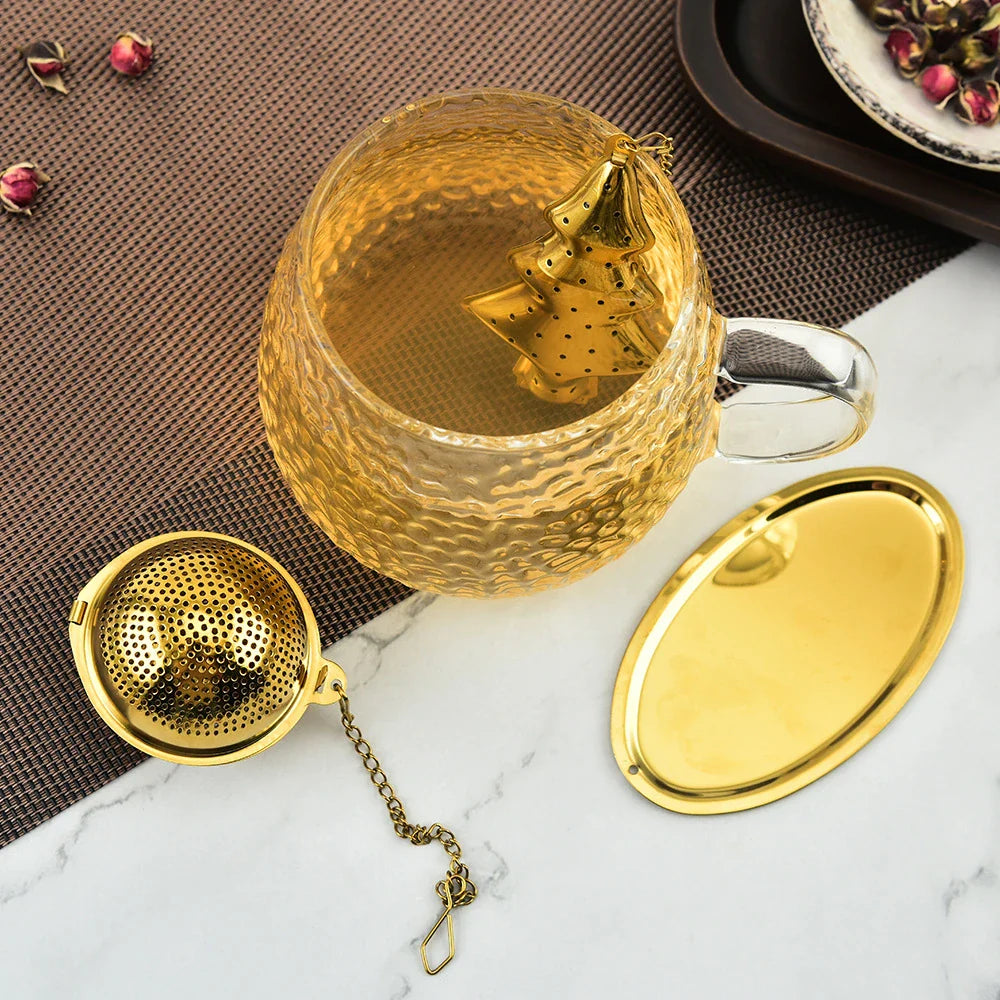 Gold pendant tea infuser with stainless steel construction and an elegant, modern design