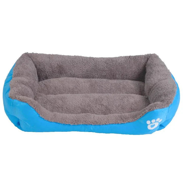 A cozy, waterproof pet bed featuring a soft fleece lining and paw print design, perfect for providing comfort and support for your beloved companion.