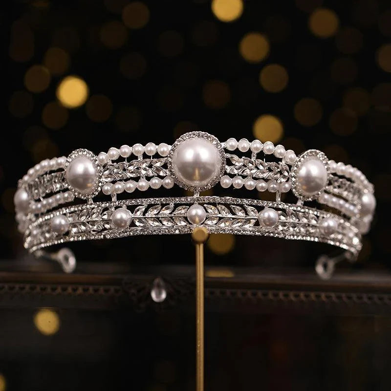 Elegant pearl crown and veil set with intricate silver or gold plated alloy design and sparkling crystal accents, perfect for a fairytale wedding day