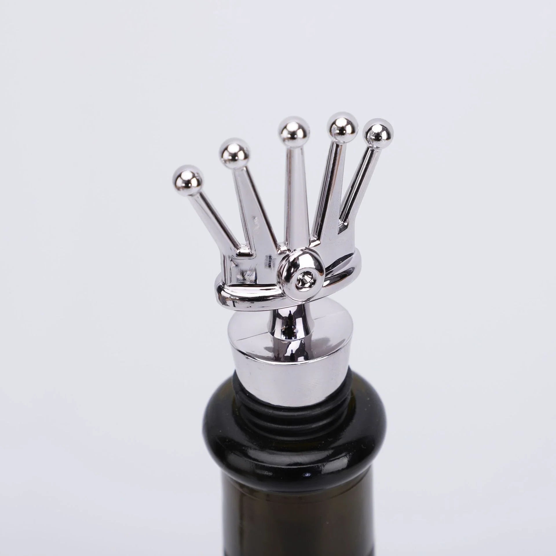 Premium iron wine stopper with stylish crown or snowflake design, sealing in freshness and adding decorative flair to wine and champagne bottles