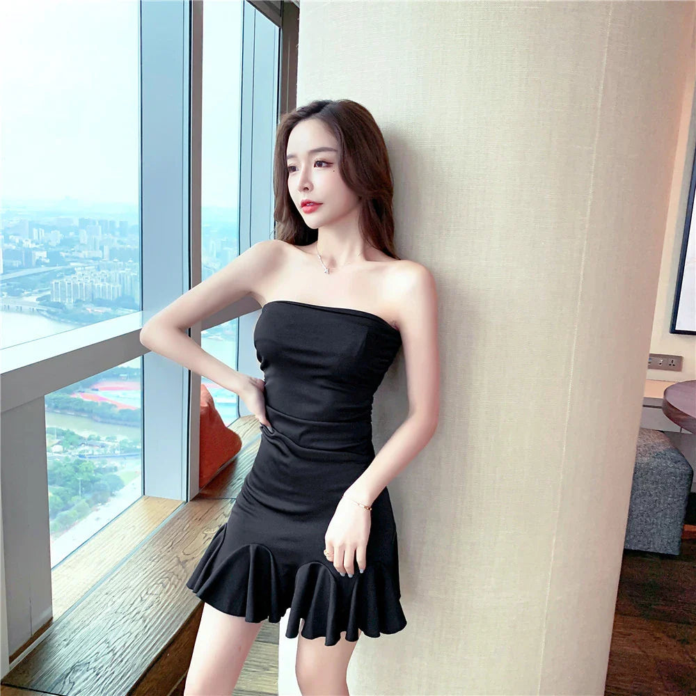 A stylish off-the-shoulder dress with ruffled hip detail, available in black and lake blue colors