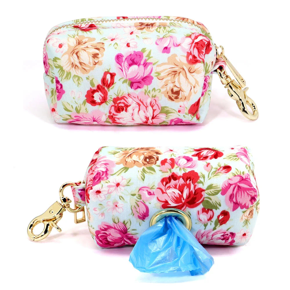 Durable nylon dog bag with floral print design, featuring multiple compartments for treats, waste bags, and other essentials.