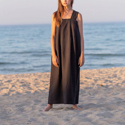 Stylish square collar sleeveless midi sundress in black, featuring a flowing A-line silhouette and practical pockets for versatile summer wear.