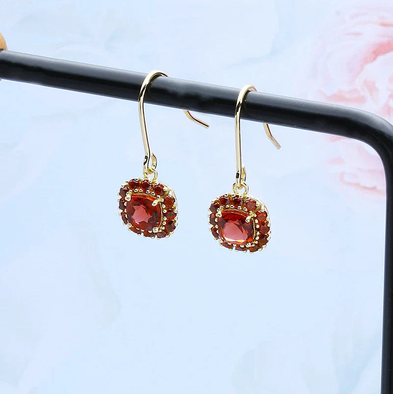 Stylish red pomegranate-inspired earrings made from premium silver with a modern, geometric design