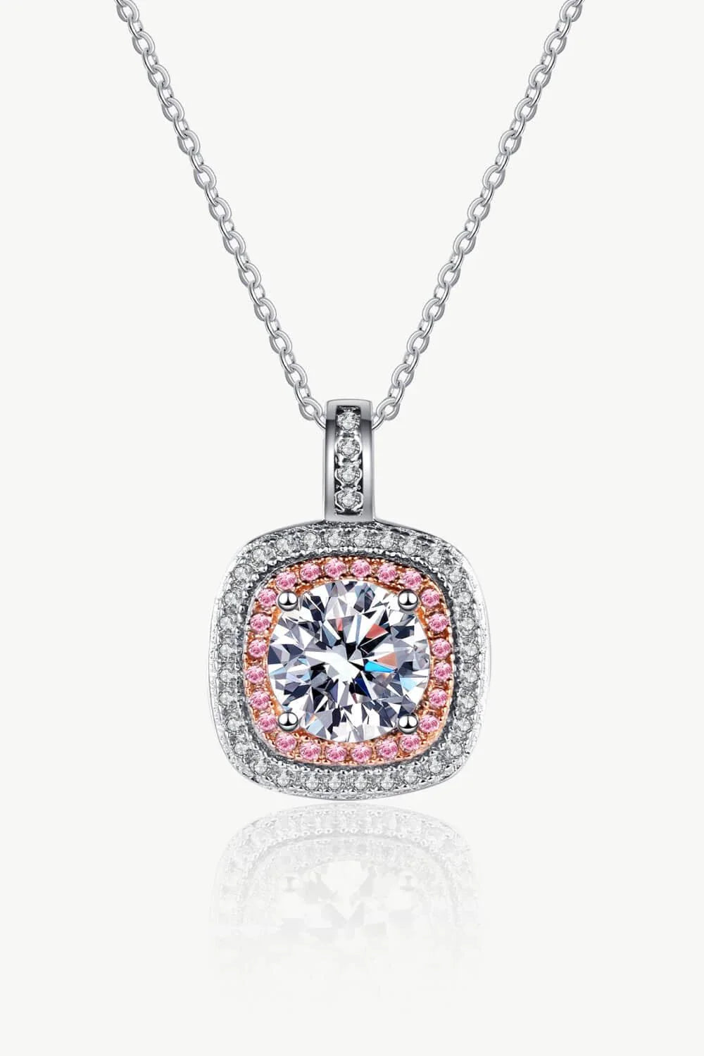 A sterling silver geometric pendant necklace featuring a radiant Moissanite centre stone and accented with shimmering zircon stones