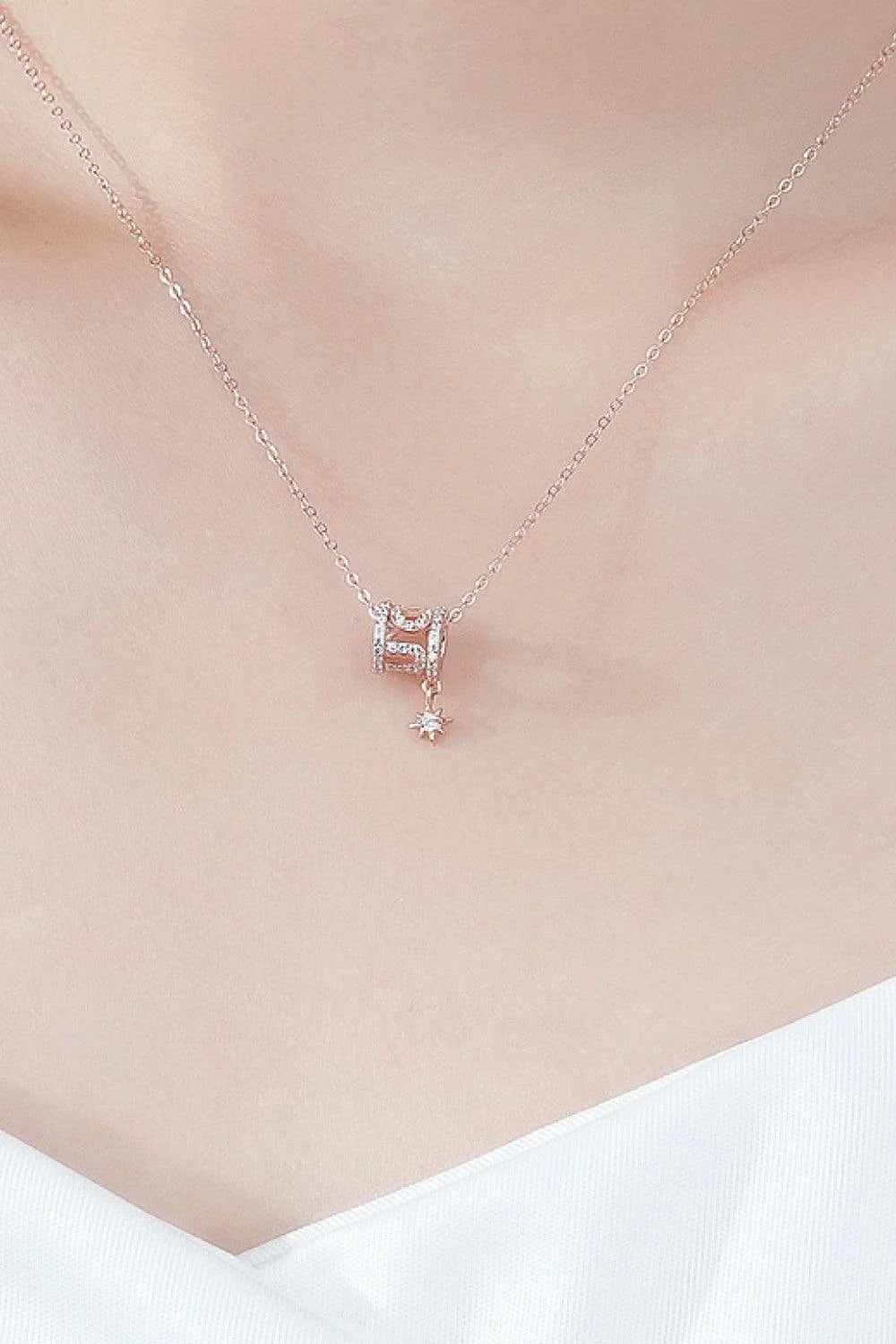 Sparkling cubic zirconia pendant necklace in silver, featuring a minimalist star-inspired design and premium 925 sterling silver construction