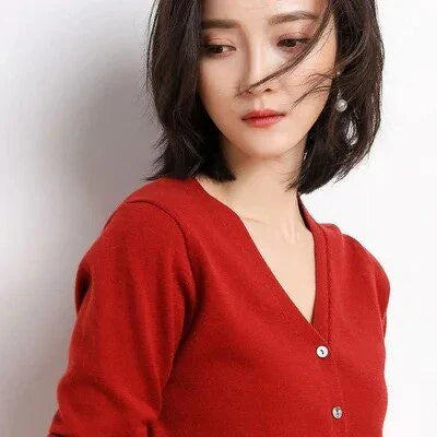 Stylish v-neck cardigan in various colors, featuring a flattering design and luxurious cashmere-rich composition for the modern Kiwi woman