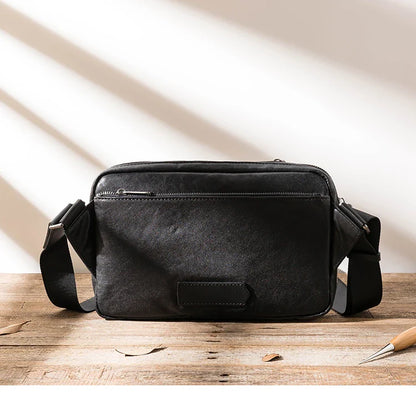 Stylish New Zealand-made leather shoulder bag in black for men, featuring a spacious design and adjustable strap for everyday use.
