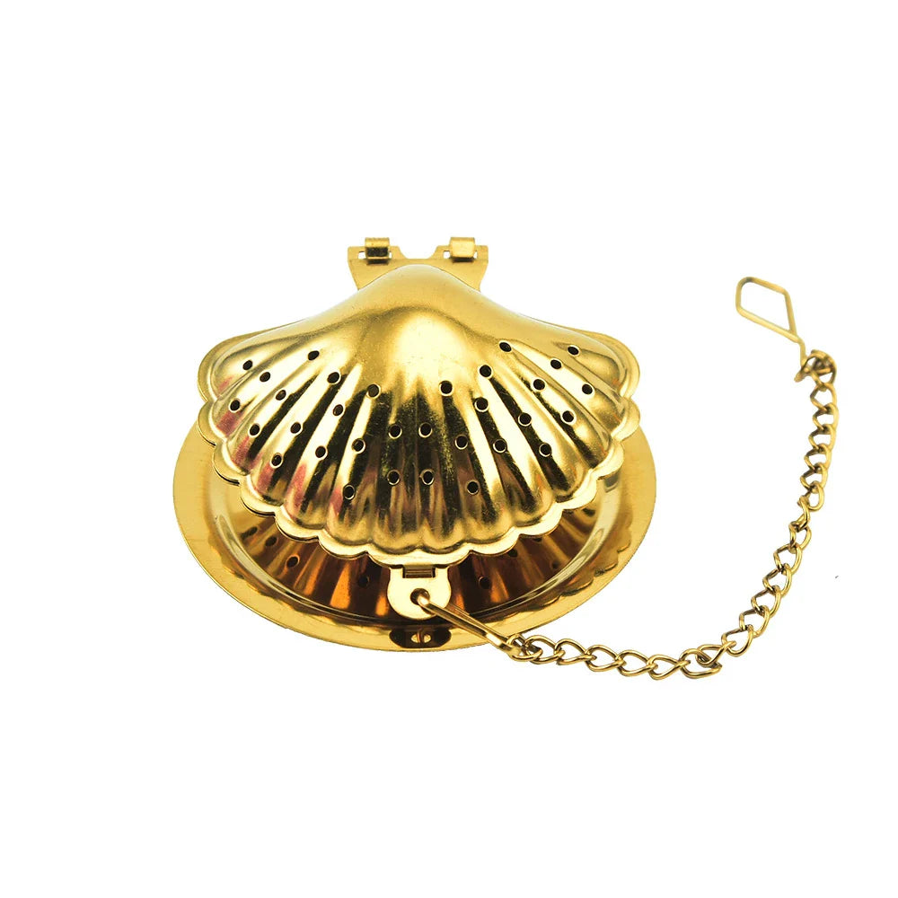 Gold pendant tea infuser with stainless steel construction and an elegant, modern design