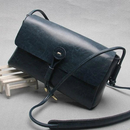 Premium leather messenger bag with a trendy square shape, subtle car stitch detailing, and an adjustable shoulder strap for the discerning Kiwi