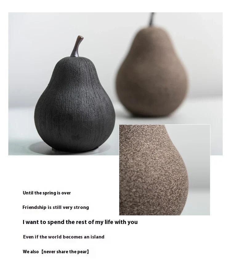 Handcrafted ceramic pear decoration with a sleek, modern design, perfect for adding a touch of natural elegance to any Kiwi home