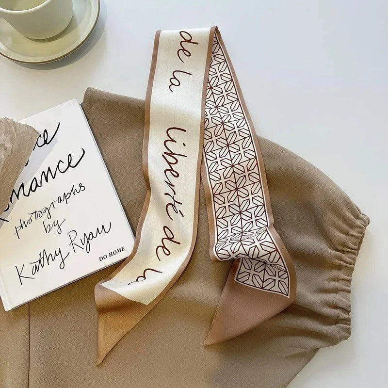 A high-quality silk scarf hair band in a versatile khaki nude color, perfect for adding elegance to any Kiwi outfit.