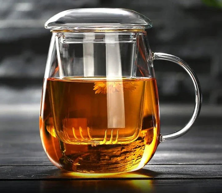 A sleek, minimalist glass tea mug with a touch of Chinese-inspired elegance, perfect for enjoying hot or cold beverages.