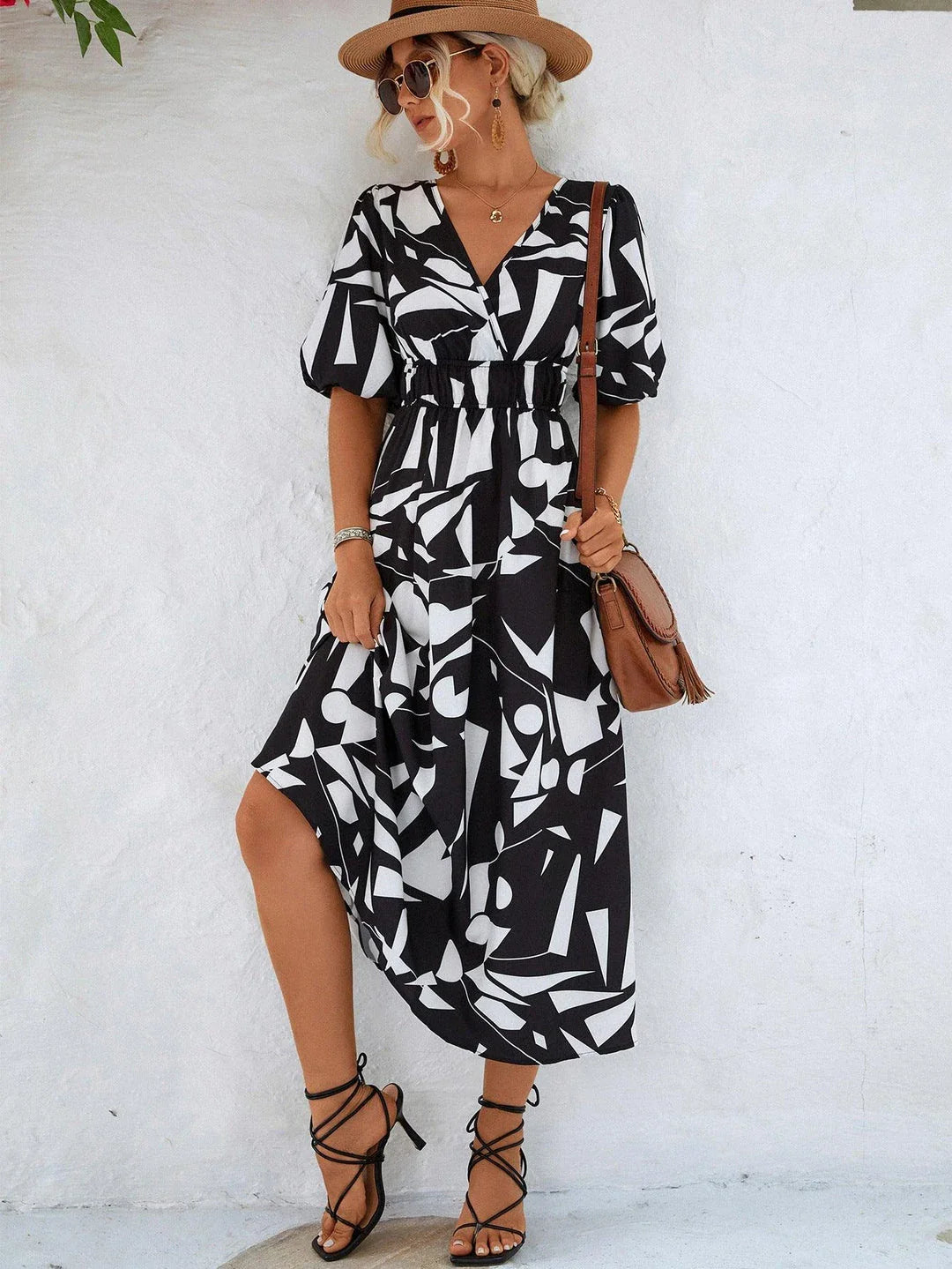 A stylish puff-sleeve dress with a printed surplice neckline, perfect for casual and dressy occasions.