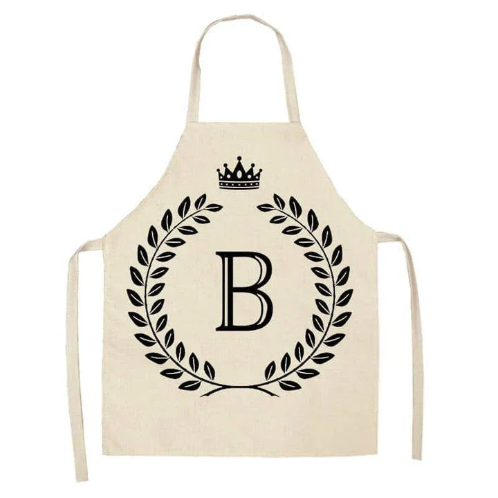 A crown and letter printed kitchen apron made of high-quality cotton and linen, suitable for both men and women in New Zealand kitchens.