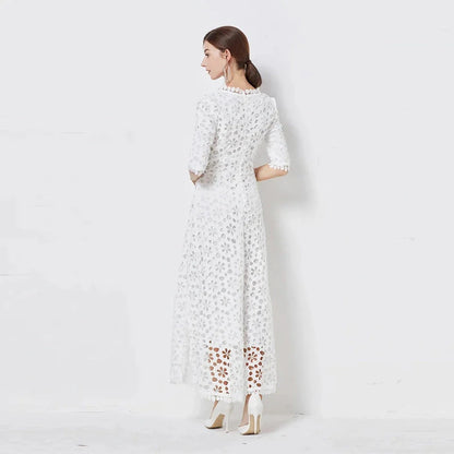 A white lace maxi dress with a stylish V-neck design, perfect for special occasions.