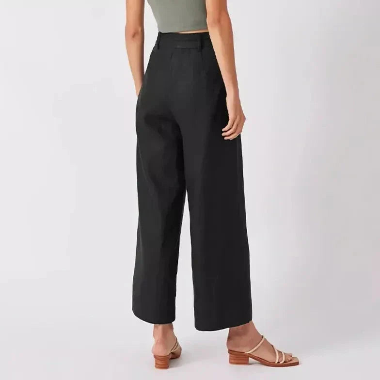 Elegant high-waist linen trousers with Korean-inspired design, featuring lace-up detail and button decorations for a sophisticated and comfortable look.