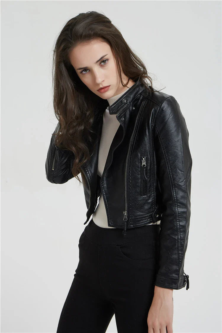 Trendha Women's Short Leather Jacket in Black, featuring a weathered finish and rivet detailing for a stylish, urban-inspired look