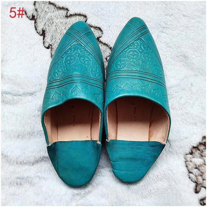 Handcrafted Moroccan leather slippers with pointed-toe design and cushioned insoles for comfort and style