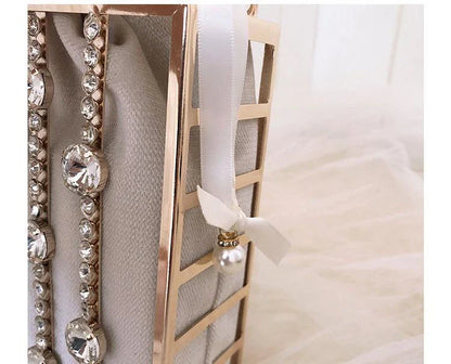 A stylish Kiwi-designed diamond-studded dinner bag with metallic accents, showcasing a range of premium features like lace, plaid, and sequins.