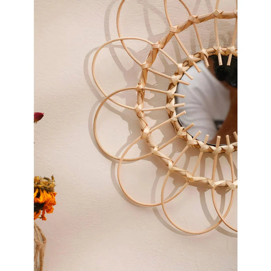 Handmade rattan wall mirror with a flower-shaped design, adding natural elegance to a Kiwi home decor