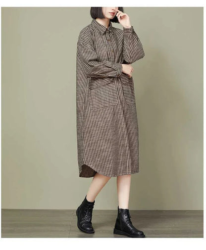 Plus-size women's dress with striped pattern, asymmetric skirt, and long sleeves