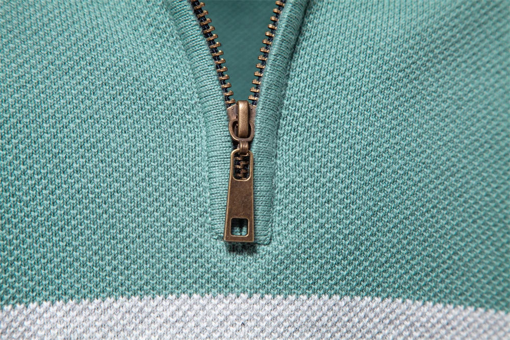 A stylish, slim-fit sweater in a modern colour-blocking design of Lake Green, White, and Grey, made with premium cotton for exceptional comfort and New Zealand casual style.