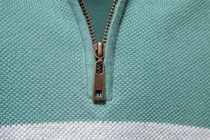 A stylish, slim-fit sweater in a modern colour-blocking design of Lake Green, White, and Grey, made with premium cotton for exceptional comfort and New Zealand casual style.