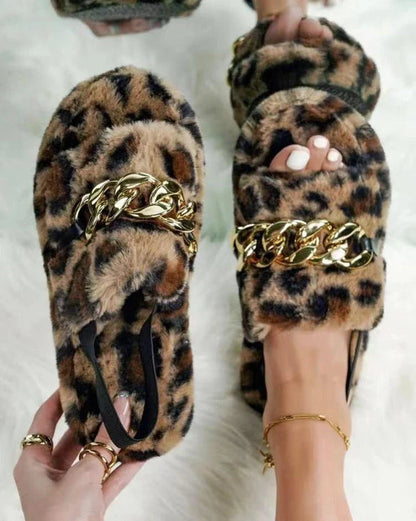 Leopard print plush slippers with metal chain accent, offering breathable comfort and stylish ethnic-inspired design.