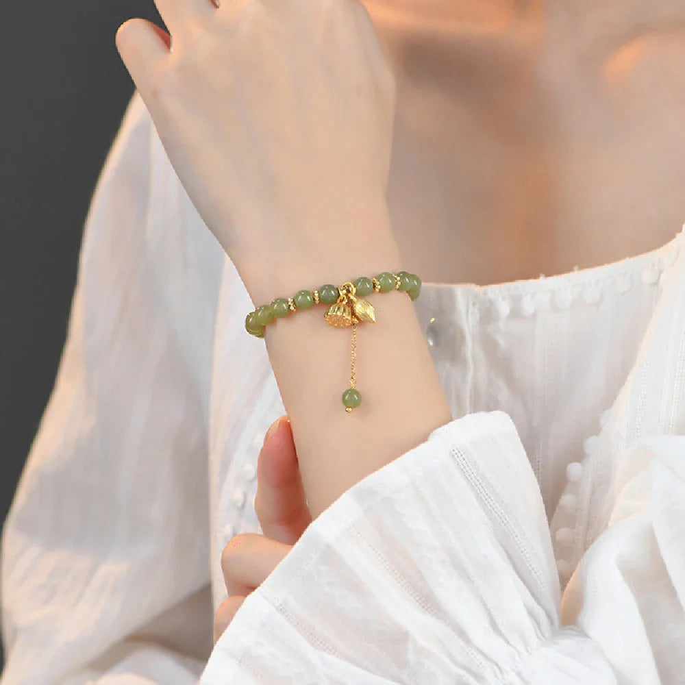 Handcrafted Hotian jade bracelet with a vintage-inspired floral design, a timeless Kiwi treasure