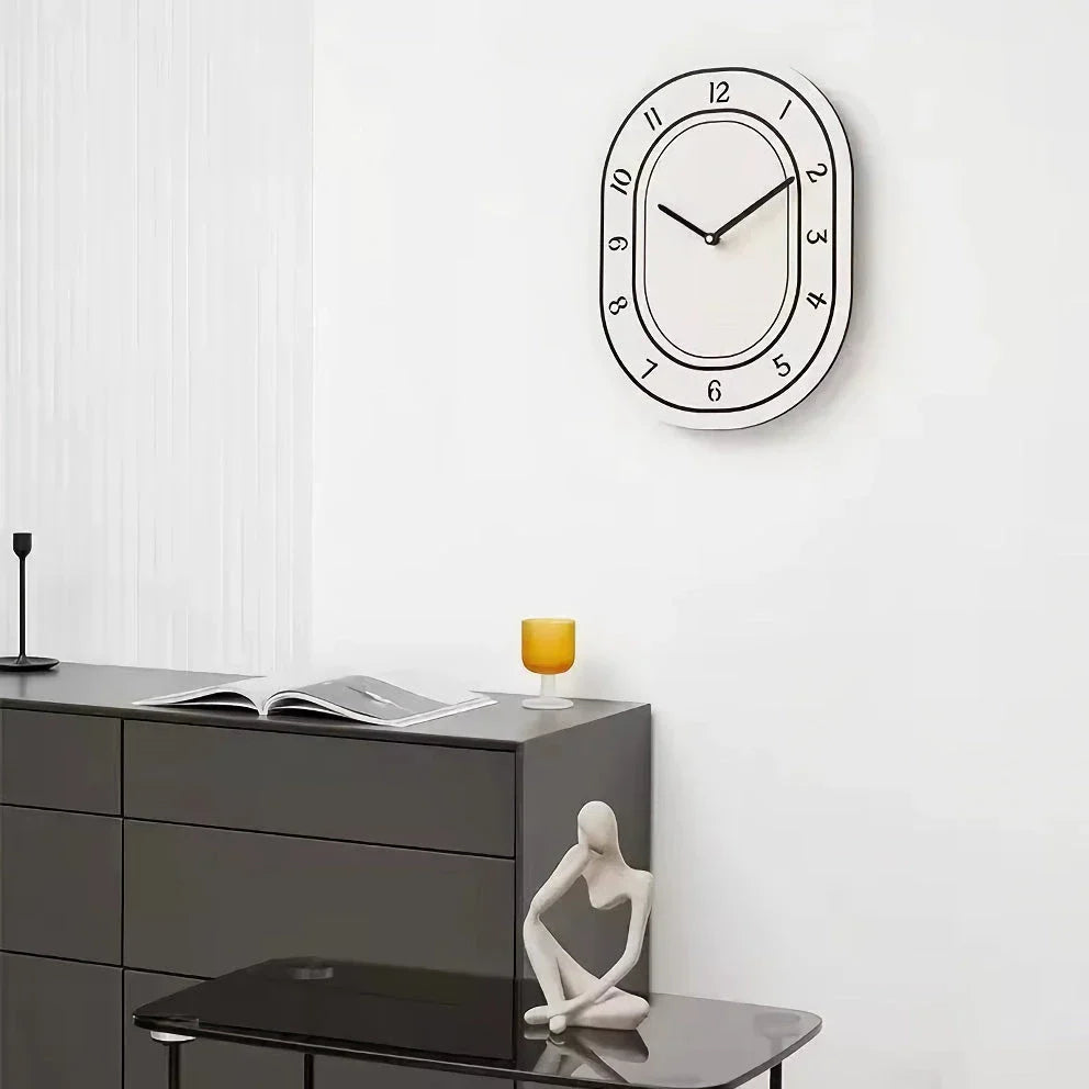 A minimalist, white wall clock with a clean design that adds a touch of modern sophistication to any Kiwi home.